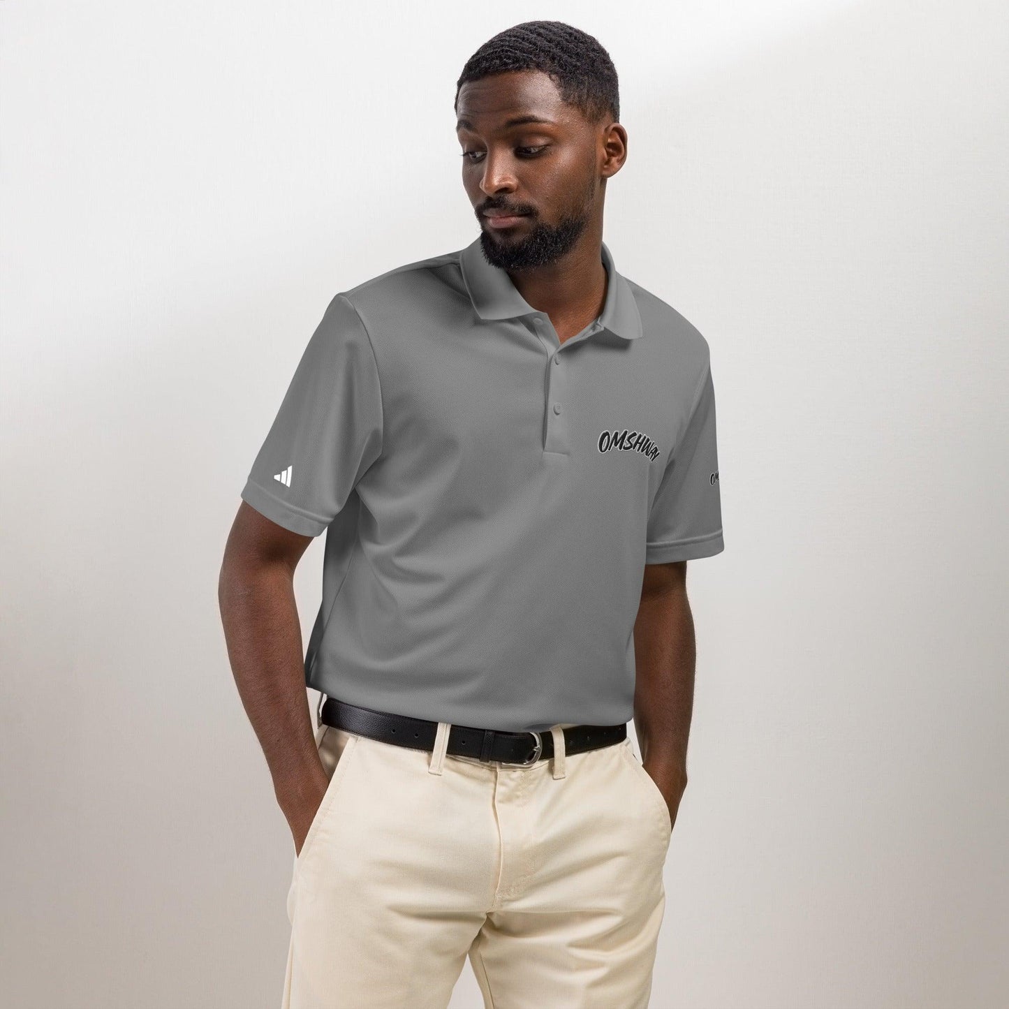 Omshway x Adidas Sport Polo featuring a sleek, athletic design with a comfortable fit, blending style and performance. Perfect for casual and active wear, with the iconic Adidas logo grey front